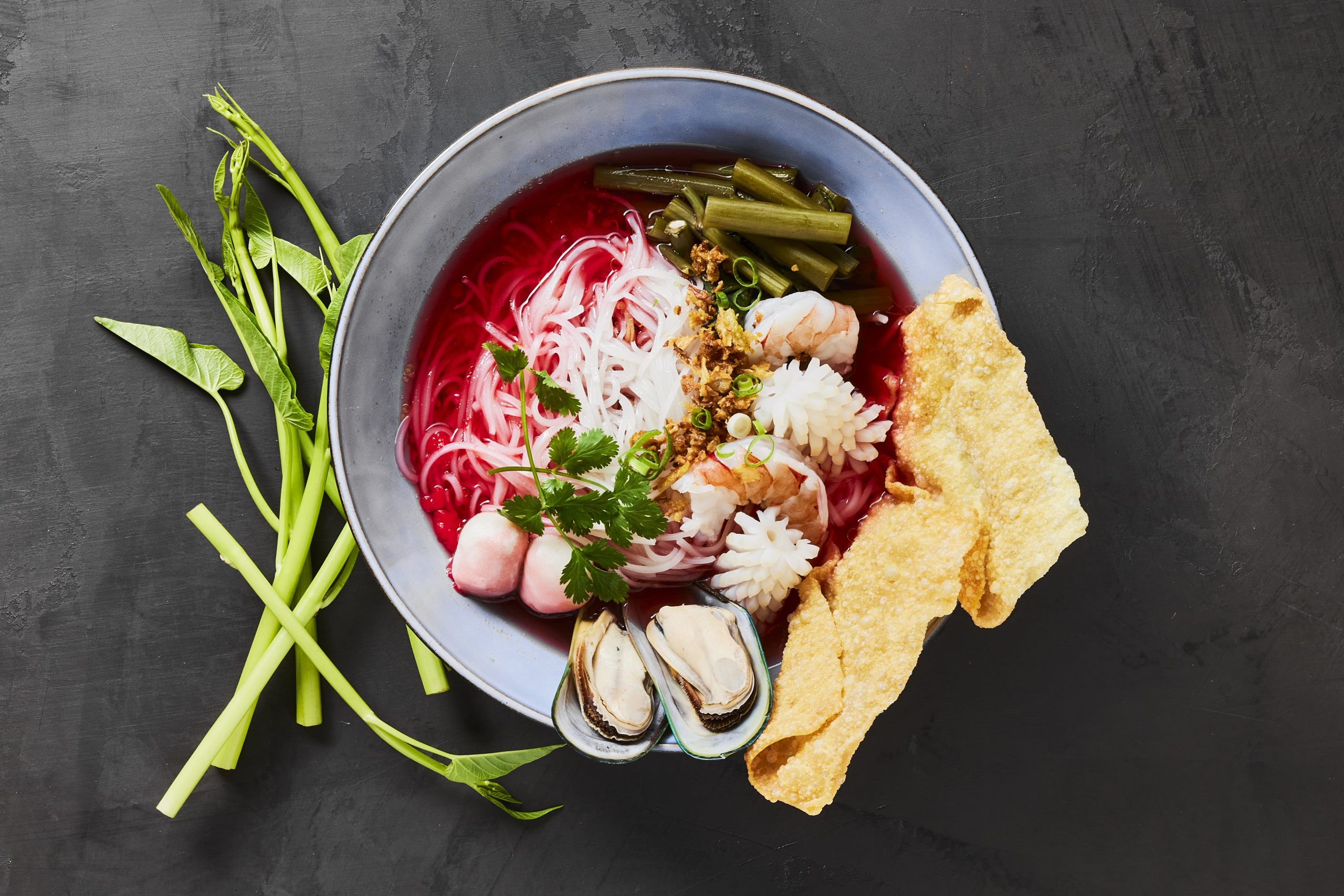 Thai noodle soup with seafood and crispy wonton